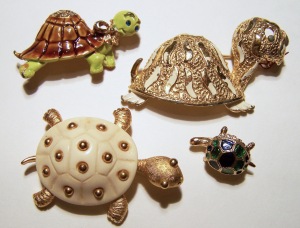 Group of turtle pins, bottom left is signed Trifari