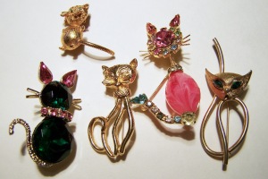 Assortment of cat pins, all from the same cardboard box