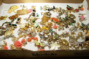Cardboard box with assorted figural jewelry